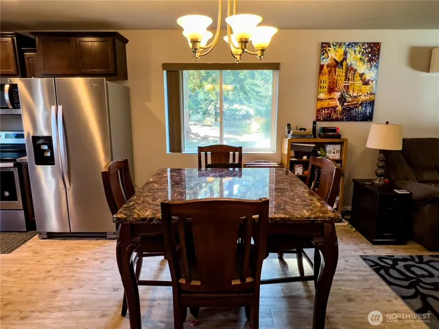 a dining room with furniture and window