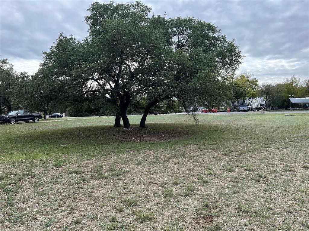 15608 Checotah Drive Austin, TX 78734 - Photo 16 of 38 a view of outdoor space with green field and trees