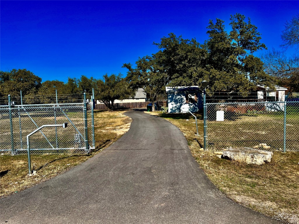 15608 Checotah Drive Austin, TX 78734 - Photo 2 of 38 a view of a lake with a yard