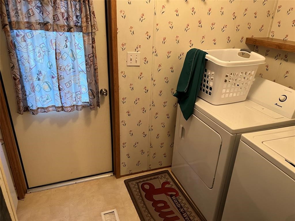 15608 Checotah Drive Austin, TX 78734 - Photo 30 of 38 a utility room with dryer and washer