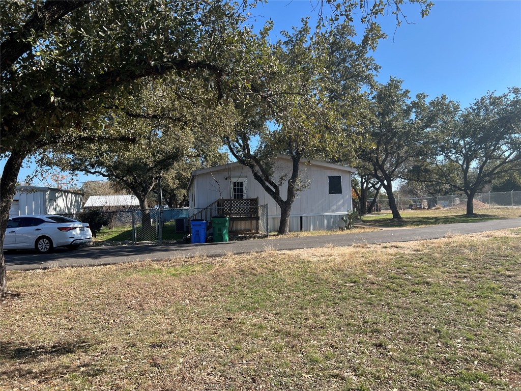 15608 Checotah Drive Austin, TX 78734 - Photo 34 of 38 a house that has a tree in front of it