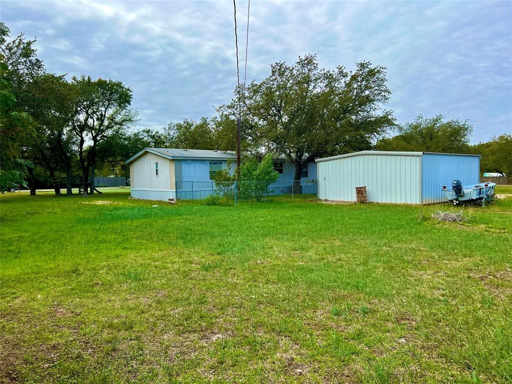 15608 Checotah Drive Austin, TX 78734 - Photo 5 of 38 a view of a house with a yard