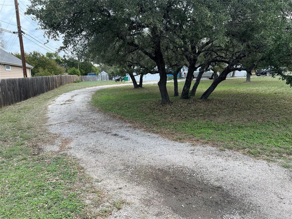15608 Checotah Drive Austin, TX 78734 - Photo 7 of 38 a view of a big yard with large trees