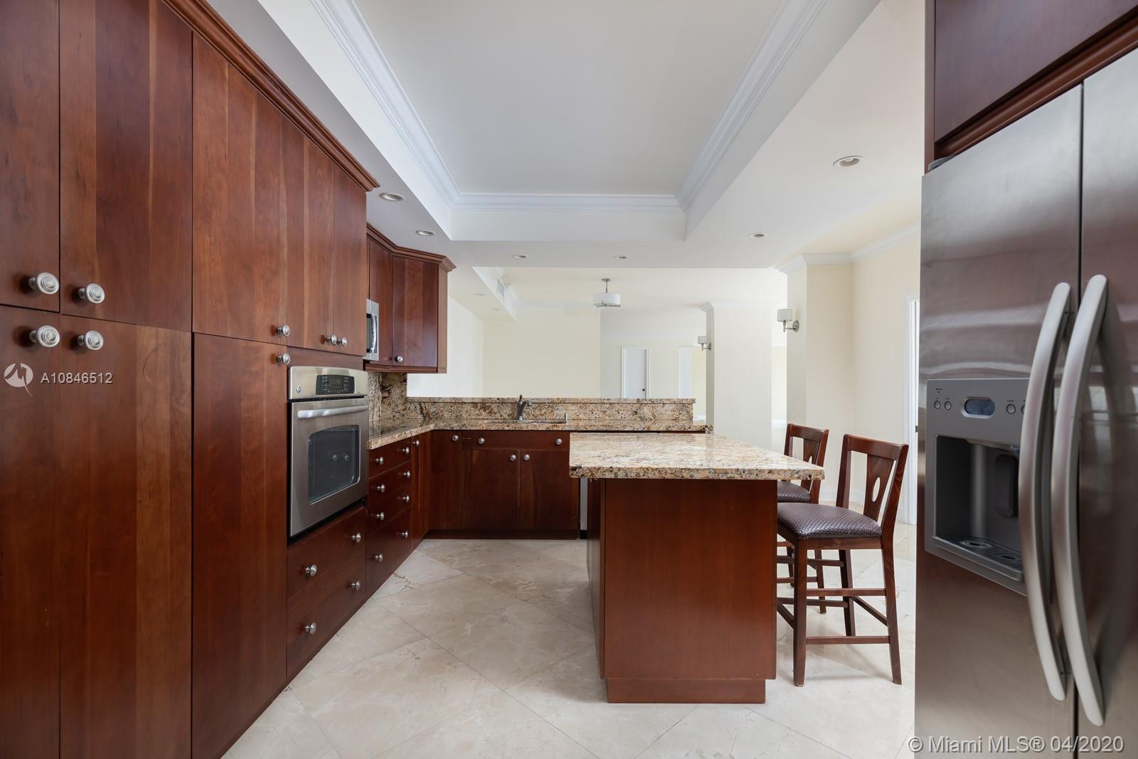 2333 Brickell Avenue, Unit TSD Miami, FL 33129 - Photo 15 of 44 a kitchen with stainless steel appliances granite countertop a refrigerator a stove a sink dishwasher and a microwave oven with cabinets