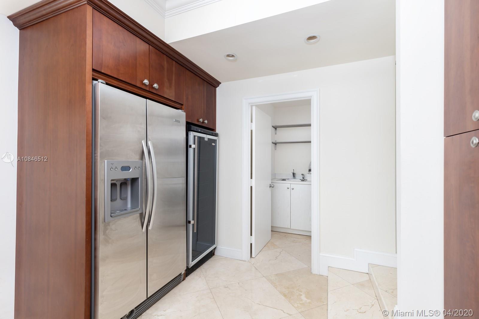 2333 Brickell Avenue, Unit TSD Miami, FL 33129 - Photo 16 of 44 a metallic refrigerator freezer sitting in a kitchen