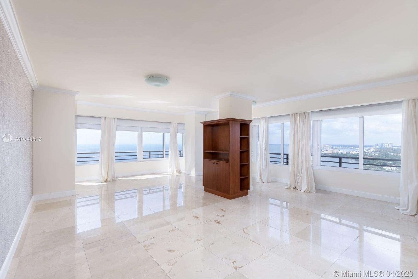 2333 Brickell Avenue, Unit TSD Miami, FL 33129 - Photo 20 of 44 an empty room with windows and way to kitchen