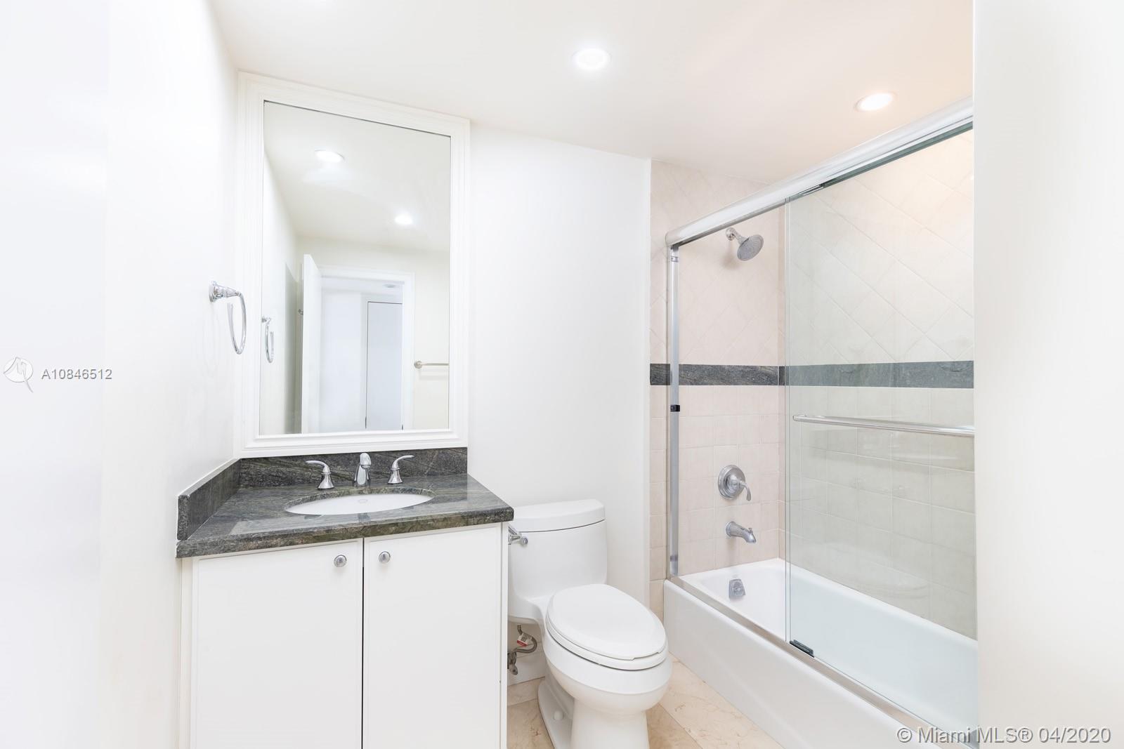 2333 Brickell Avenue, Unit TSD Miami, FL 33129 - Photo 33 of 44 a bathroom with a granite countertop sink toilet and shower