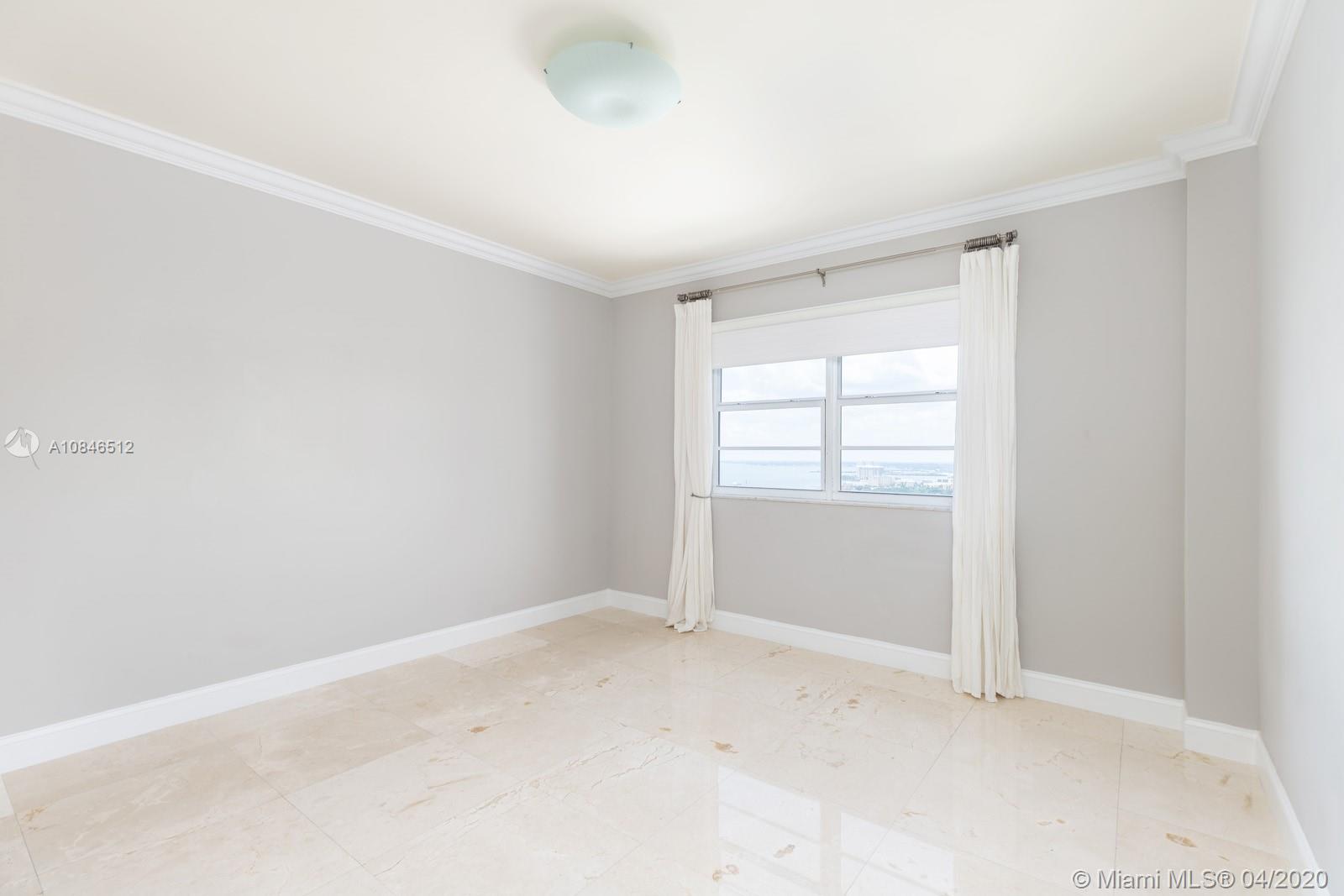 2333 Brickell Avenue, Unit TSD Miami, FL 33129 - Photo 34 of 44 an empty room with windows and closet