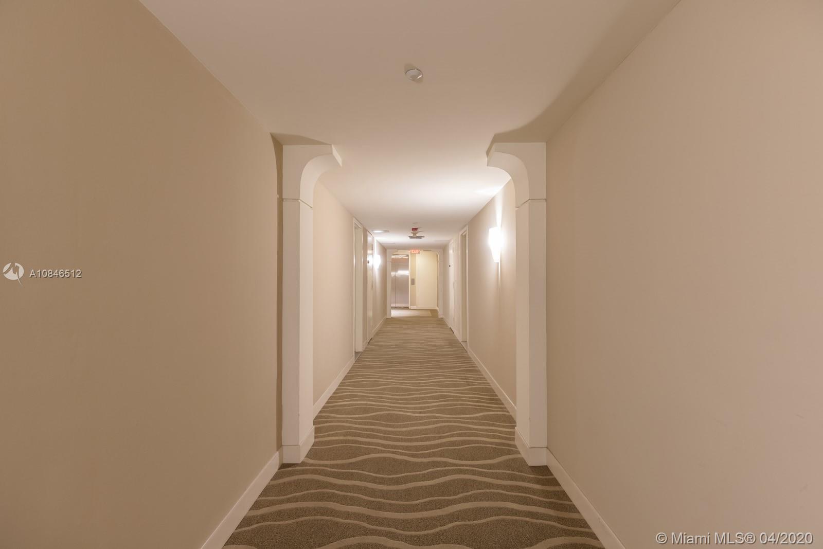 2333 Brickell Avenue, Unit TSD Miami, FL 33129 - Photo 37 of 44 a view of a hallway with wooden floor