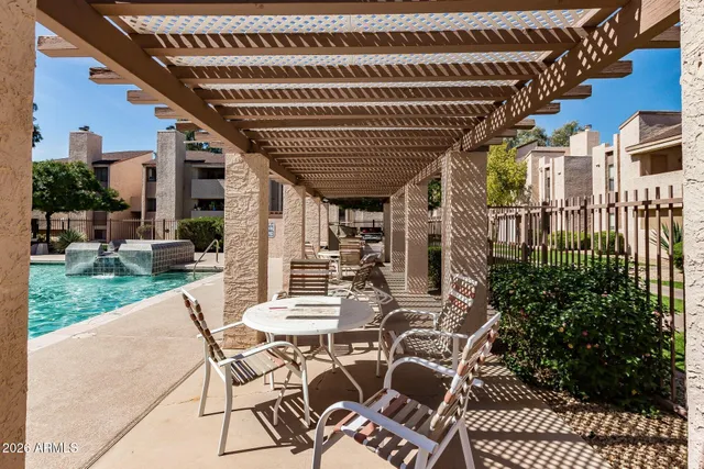 a view of a porch with furniture and garden