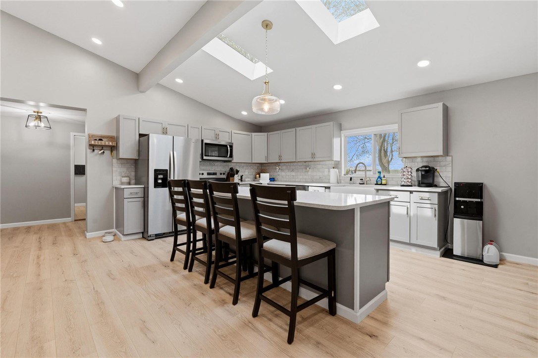 2950 Fairfield Pike Springfield, OH 45502 - Photo 14 of 48 This airy kitchen features a spacious island and skylights, brightening the entire space.