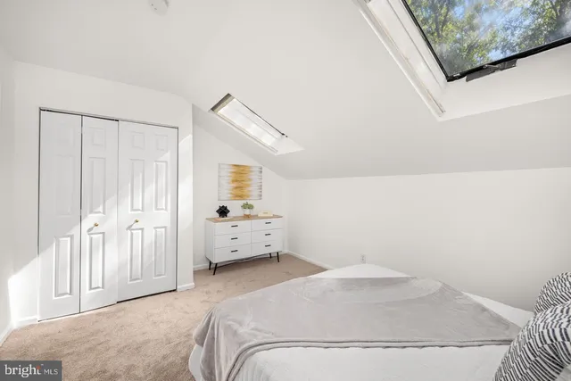 a bathroom with a sink a mirror a glass door a shower and a mirror