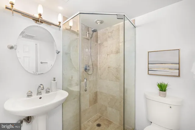 an empty room with windows and cabinet