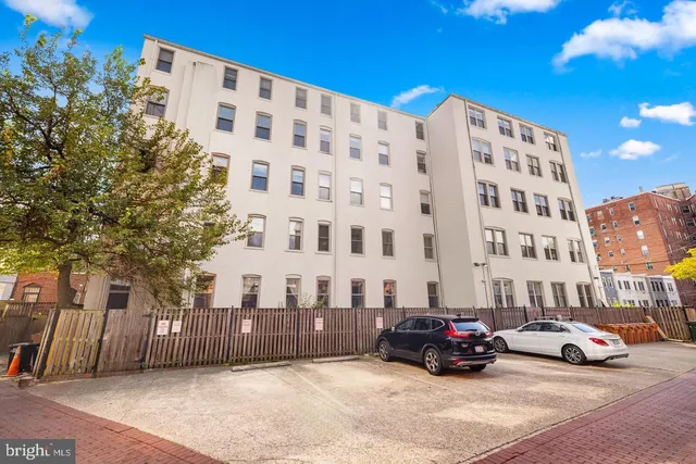 a view of a street with a building