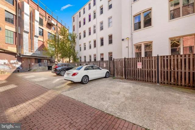 a picture of a bench in front of a wall