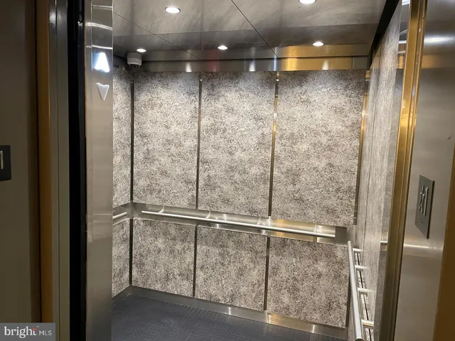 a view of a room that has a table and chair