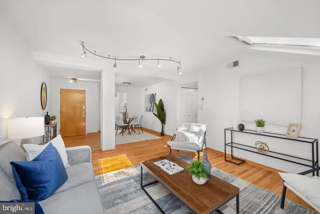 a view of a livingroom with furniture and wooden floor