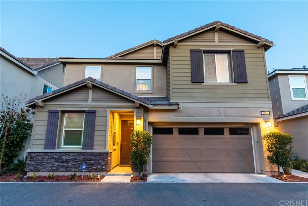 22086 Windham Way Saugus, CA 91350 - Photo 1 of 1 a front view of a house with a yard