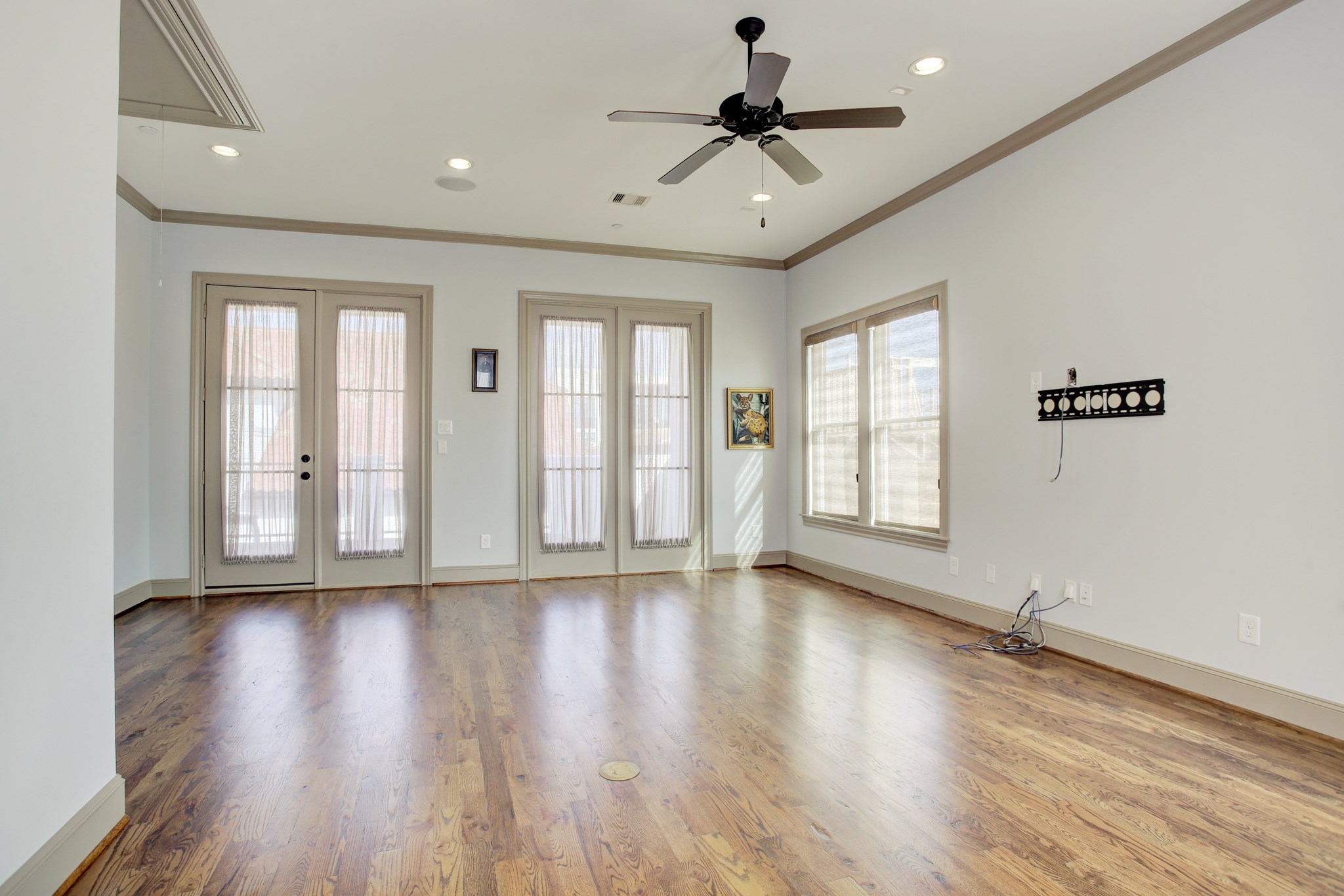 1307 Rosedale Street Houston, TX 77004 - Photo 23 of 32 a view of an empty room with a window and wooden floor