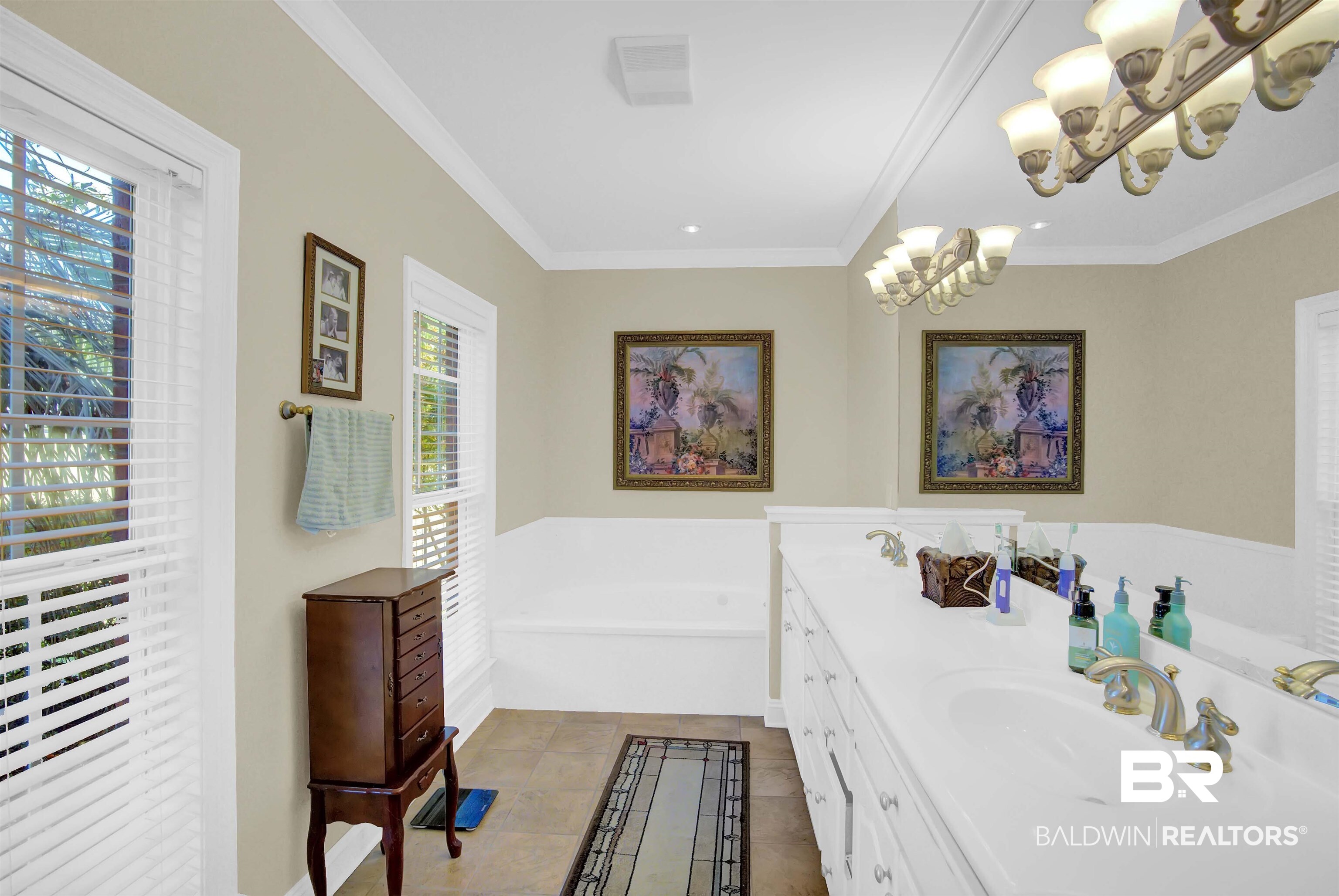27688 Rigsby Road Daphne, AL 36526 - Photo 30 of 56 Bathroom with a tub to relax in, ornamental molding, tile patterned flooring, and a wealth of natural light