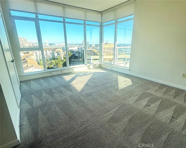 a view of an empty room with a window