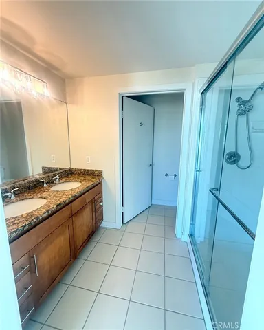 a kitchen with granite countertop a sink and a stove