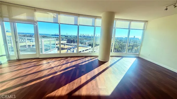 a wooden bench sitting in front of a building
