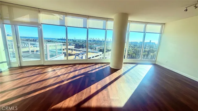 a wooden bench sitting in front of a building