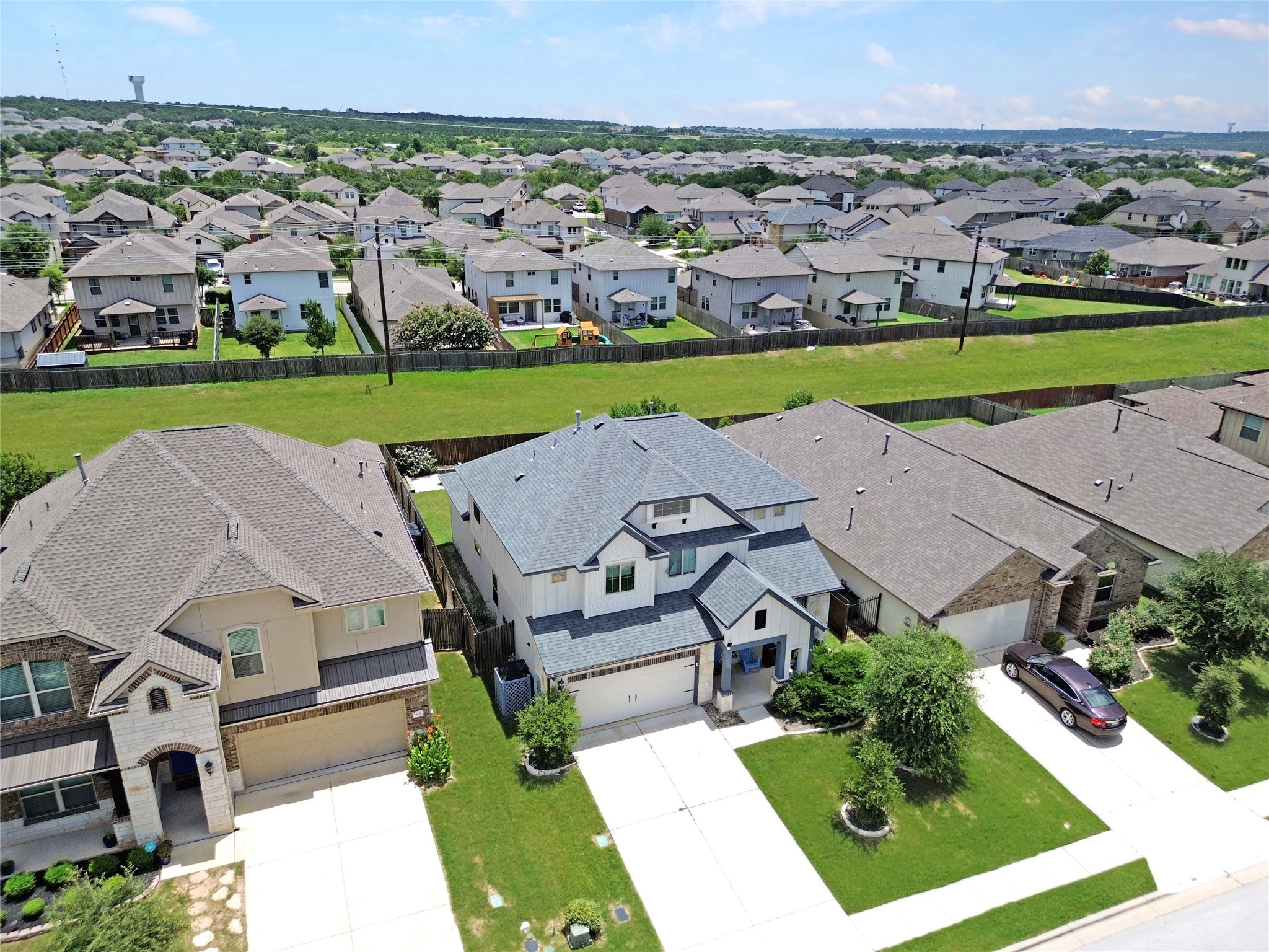 429 Rusk Bluff Avenue Leander, TX 78641 - Photo 2 of 24 An aerial perspective showcases a vibrant neighborhood with well-maintained homes and lush green lawns.