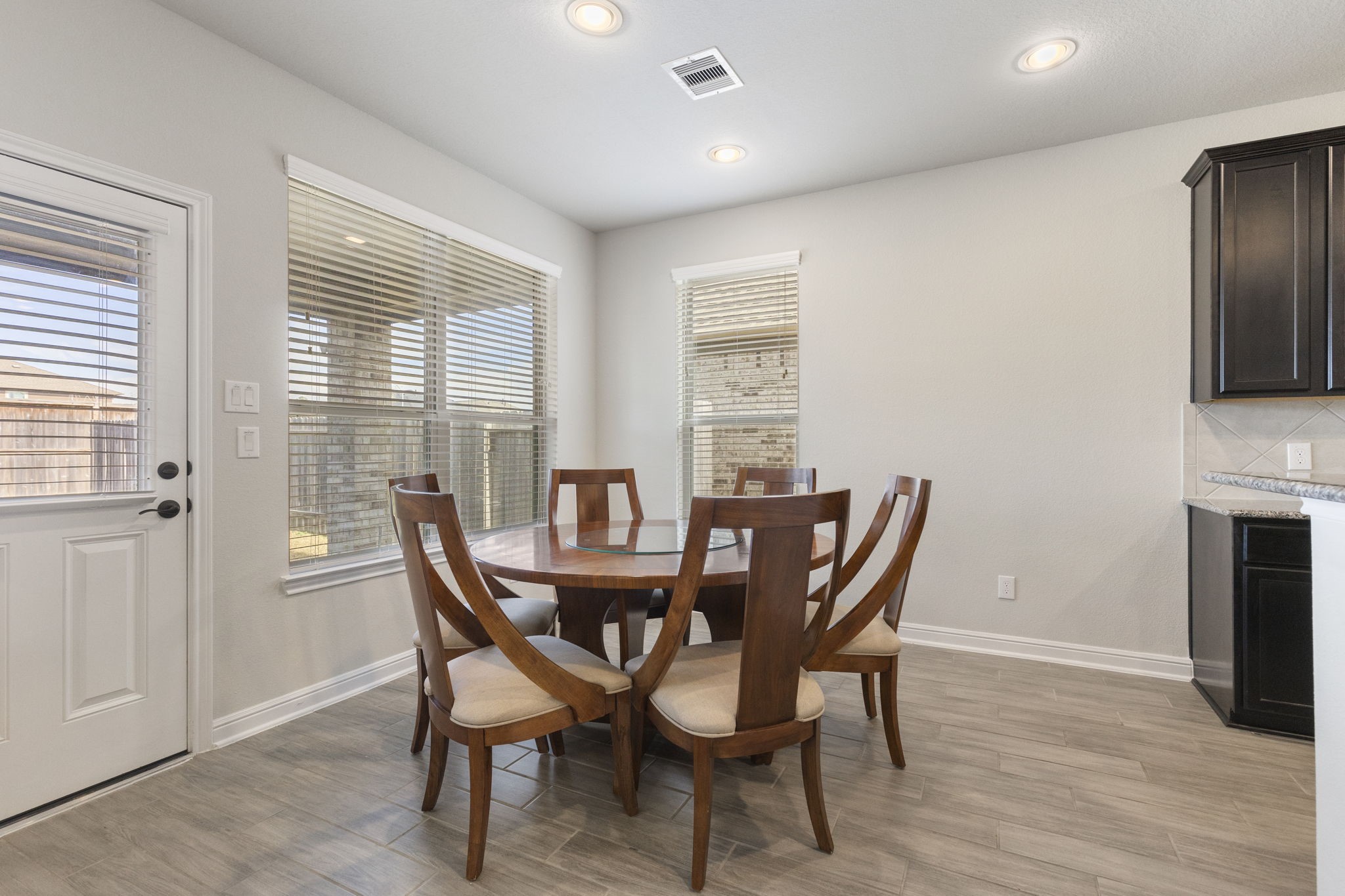 2819 Bradbury Hills Road Spring, TX 77373 - Photo 20 of 50 This inviting breakfast area boasts abundant natural light with large windows and a cozy setup, perfect for enjoying morning coffee or family meals.