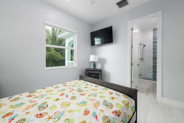 a spacious bedroom with two beds and a couch