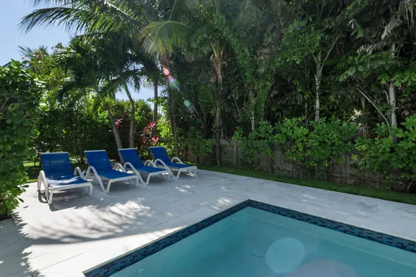 a view of a backyard with sitting area