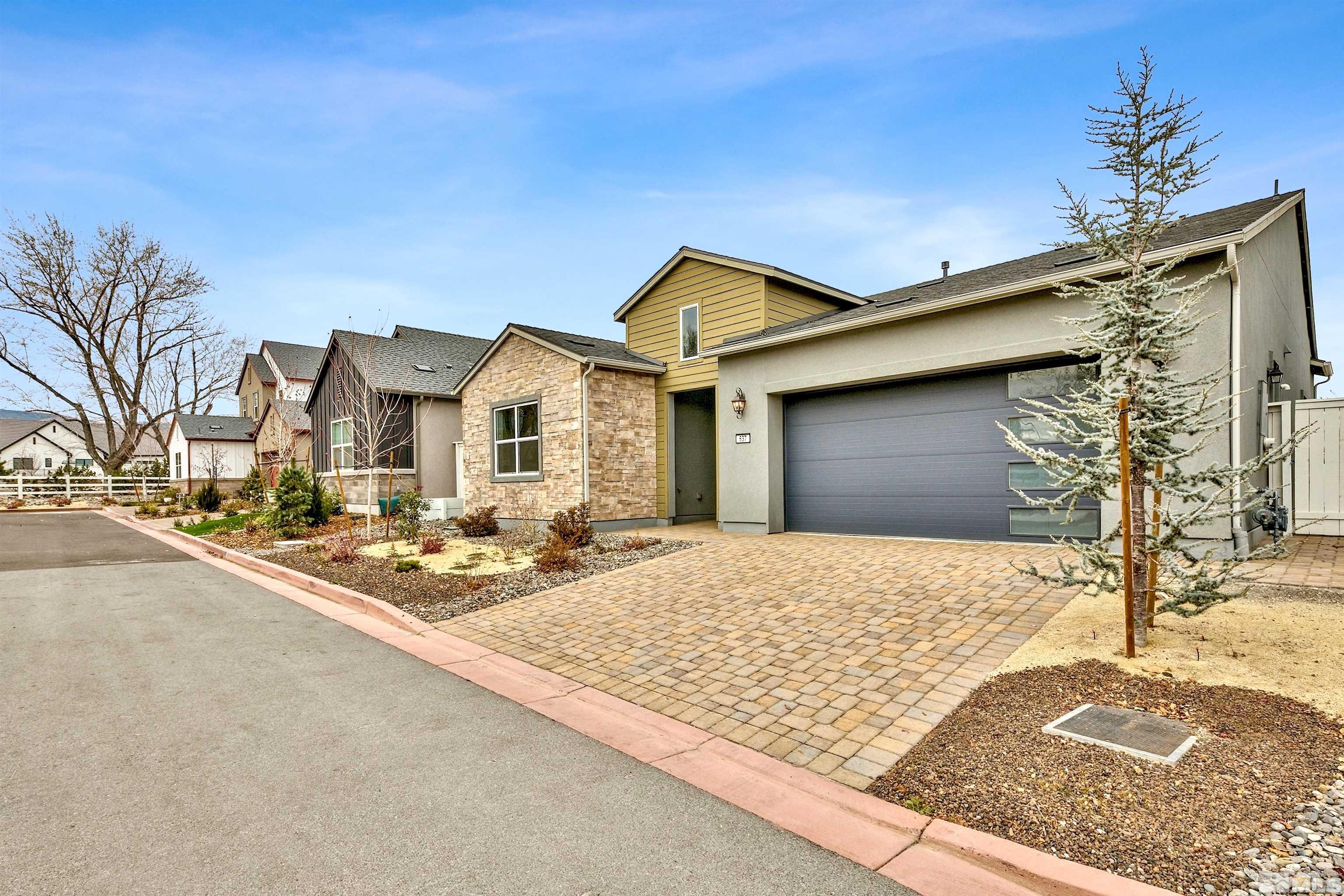 637 Braided Rope Drive Reno, NV 89511 - Photo 1 of 25 a front view of a house with basket ball court and a fire pit