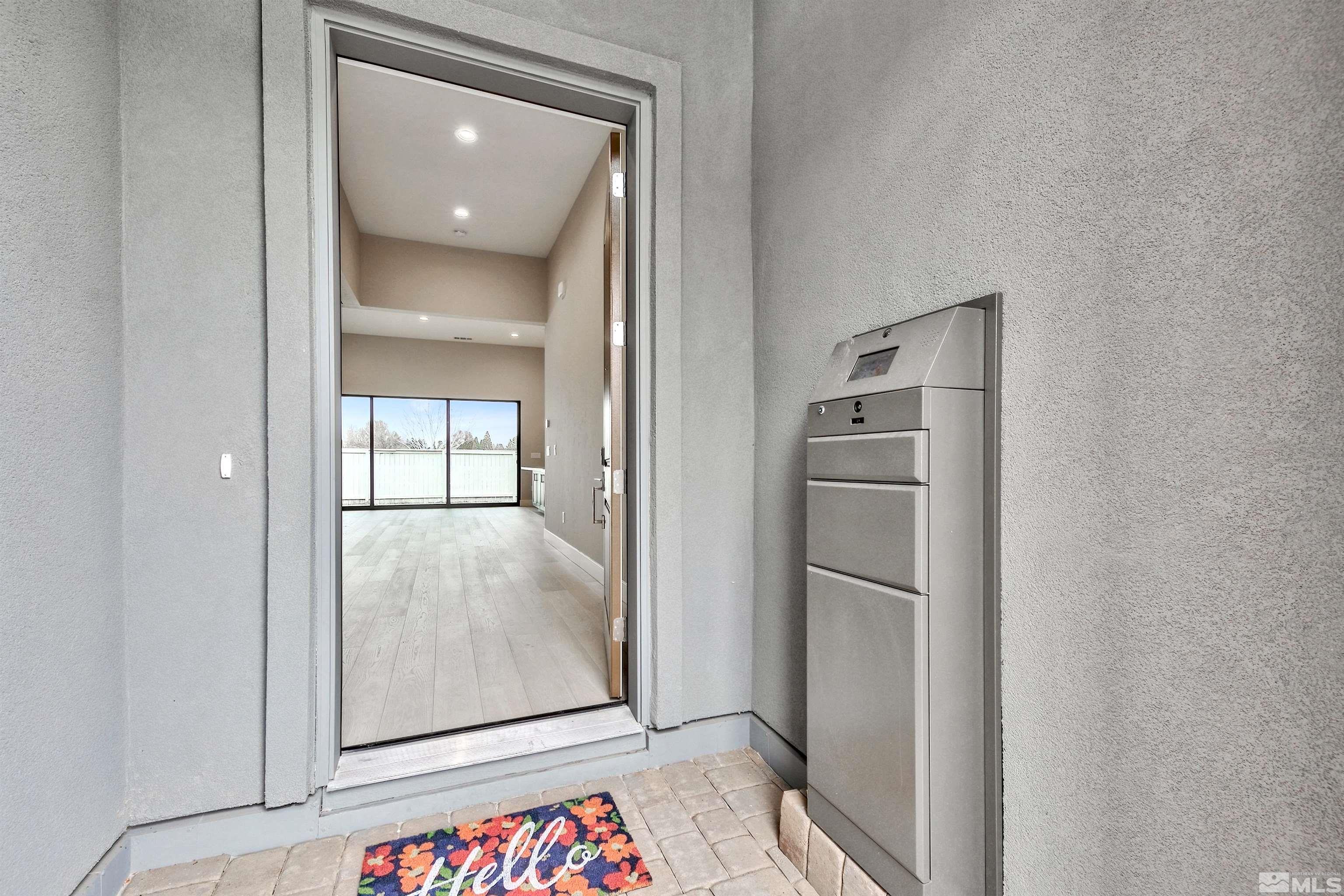 637 Braided Rope Drive Reno, NV 89511 - Photo 2 of 25 a view of hallway with walk in closet and wooden floor