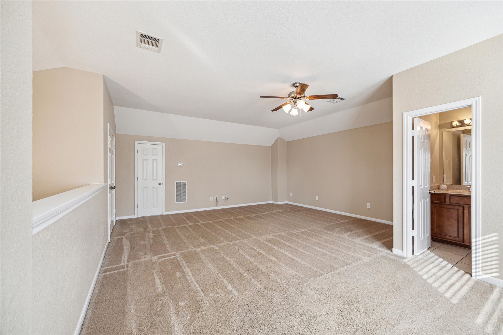 9015 Springcroft Court Tomball, TX 77375 - Photo 31 of 35 a view of an empty room with a ceiling fan