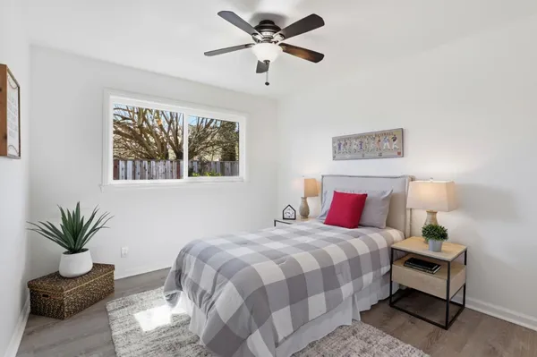 a bedroom with a bed and a couch