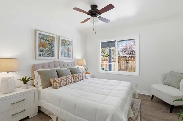 a bed room with a bed and a chandelier