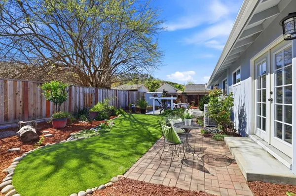 a view of a chairs and tables in the patio