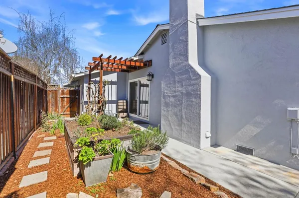 a balcony with table and chairs