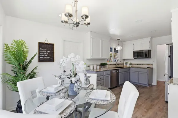 a view of a livingroom with furniture and entryway