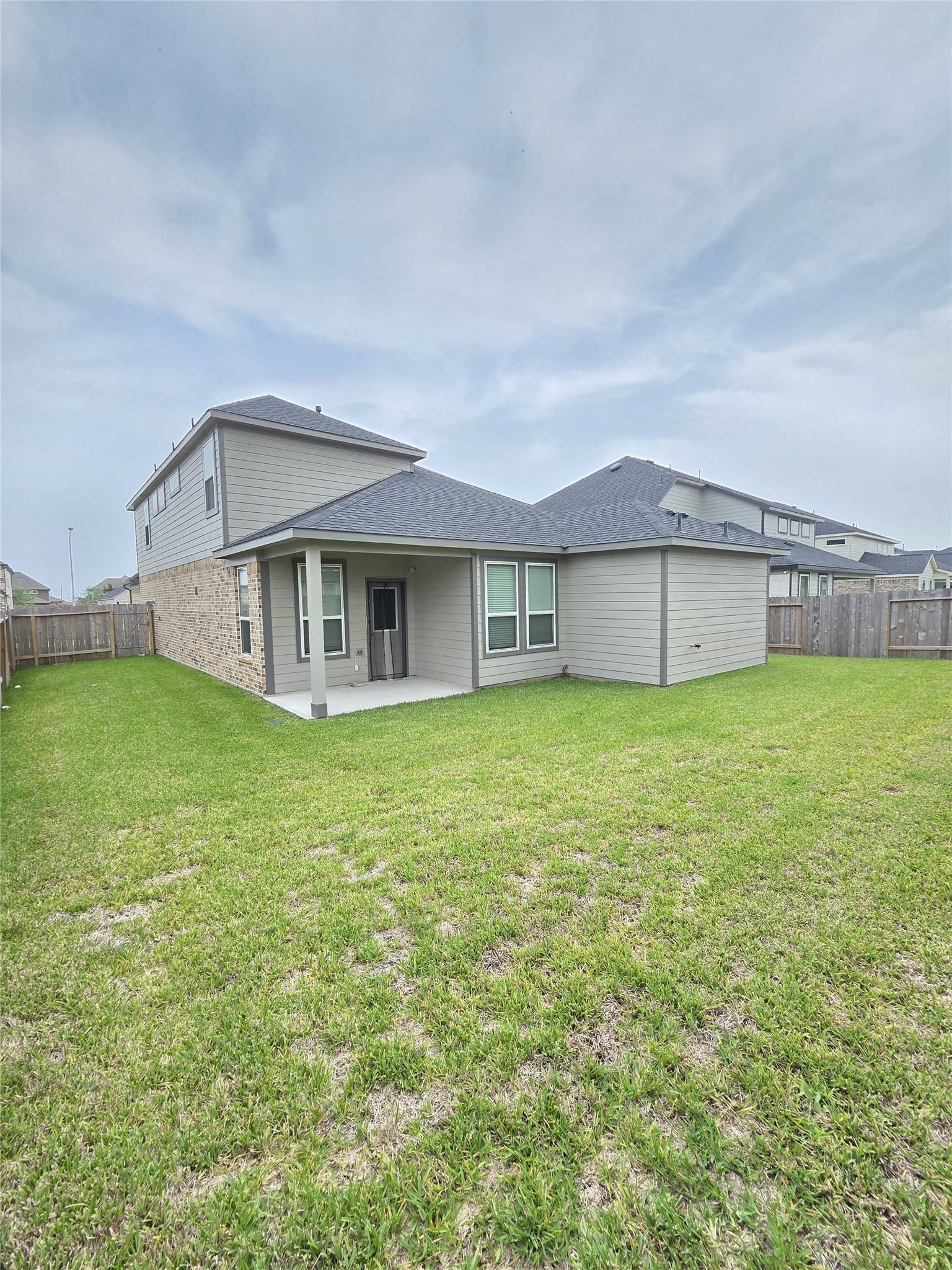 3230 Tilley Drive Rosenberg, TX 77471 - Photo 9 of 17 a front view of a house with a garden and yard