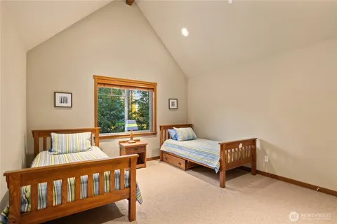 a bedroom with furniture and a window