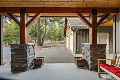 a view of patio with a table and chairs