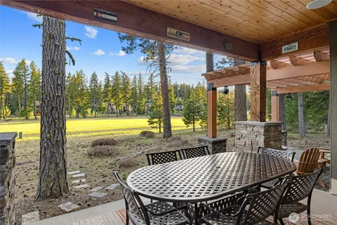 a view of a patio with a table chairs and a patio