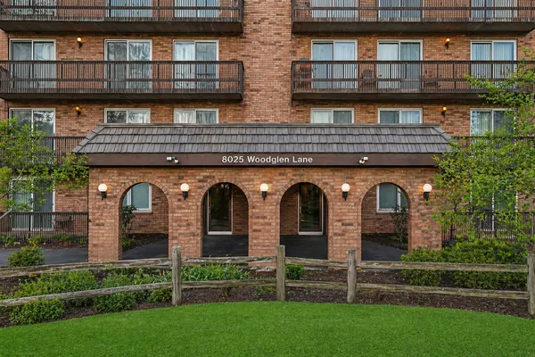a view of a brick building with many windows