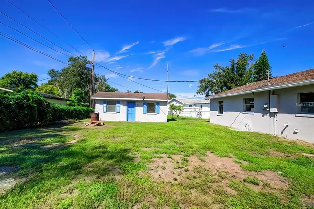 a view of a house with a back yard