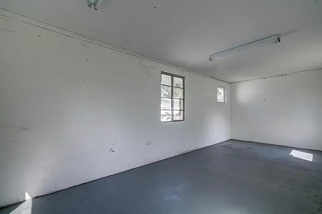 an empty room with windows
