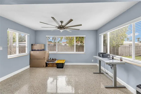 a living room with furniture and windows