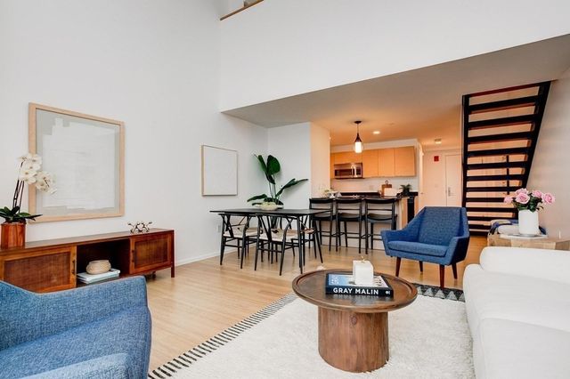 a living room with furniture and a table
