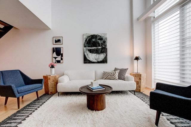 a living room with furniture and a window